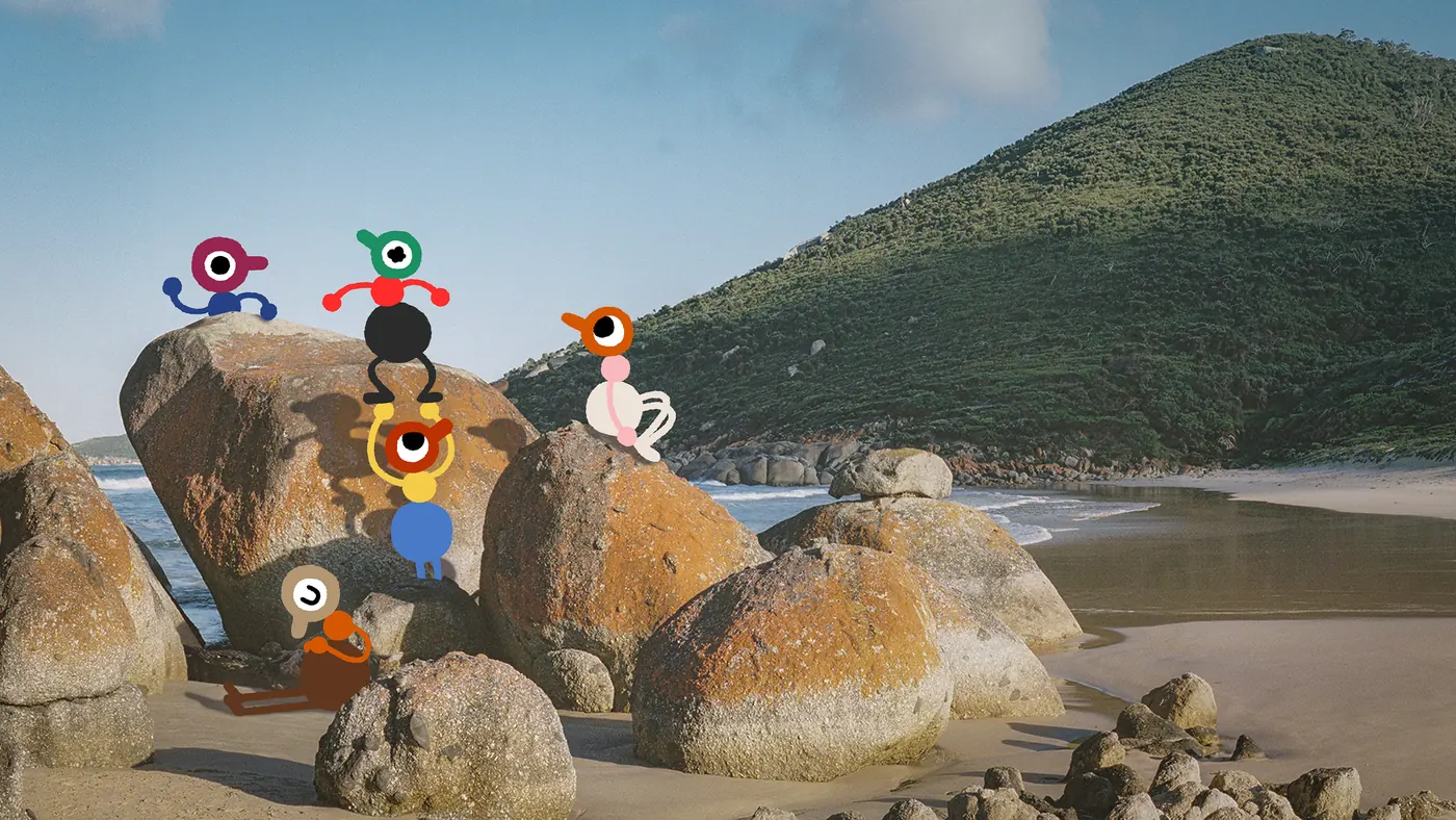 Big Walk key art: a group of characters gathered on granite boulders on a beach, with a green headland behind them.